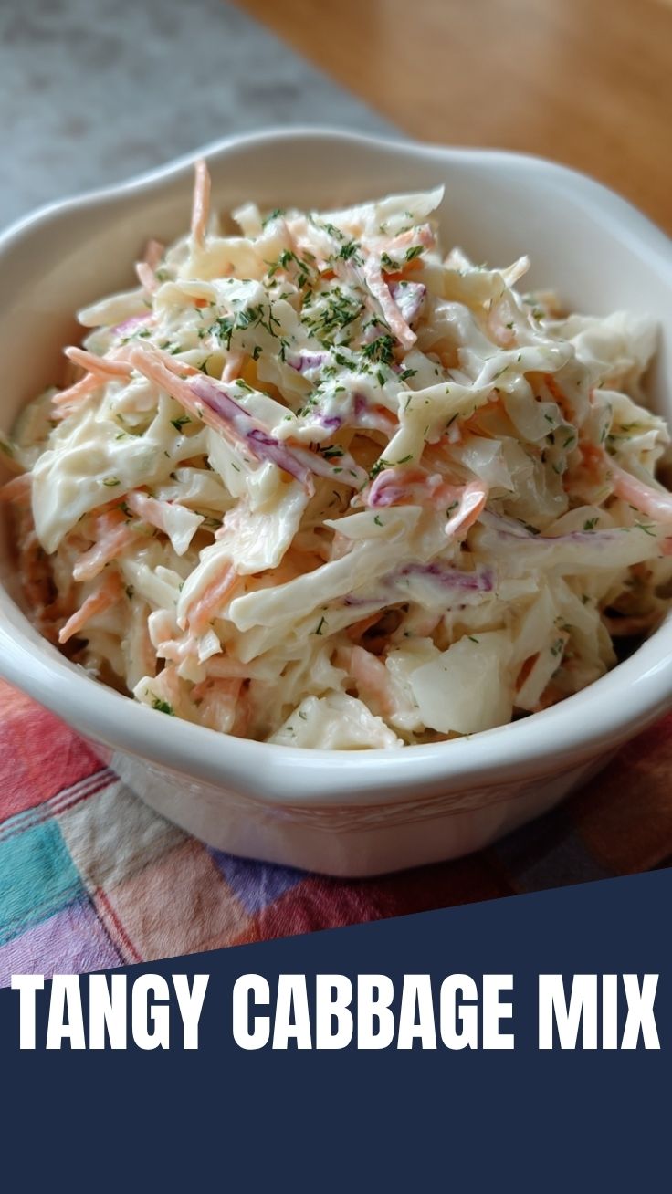 A bowl of fresh creamy coleslaw with shredded cabbage and carrots