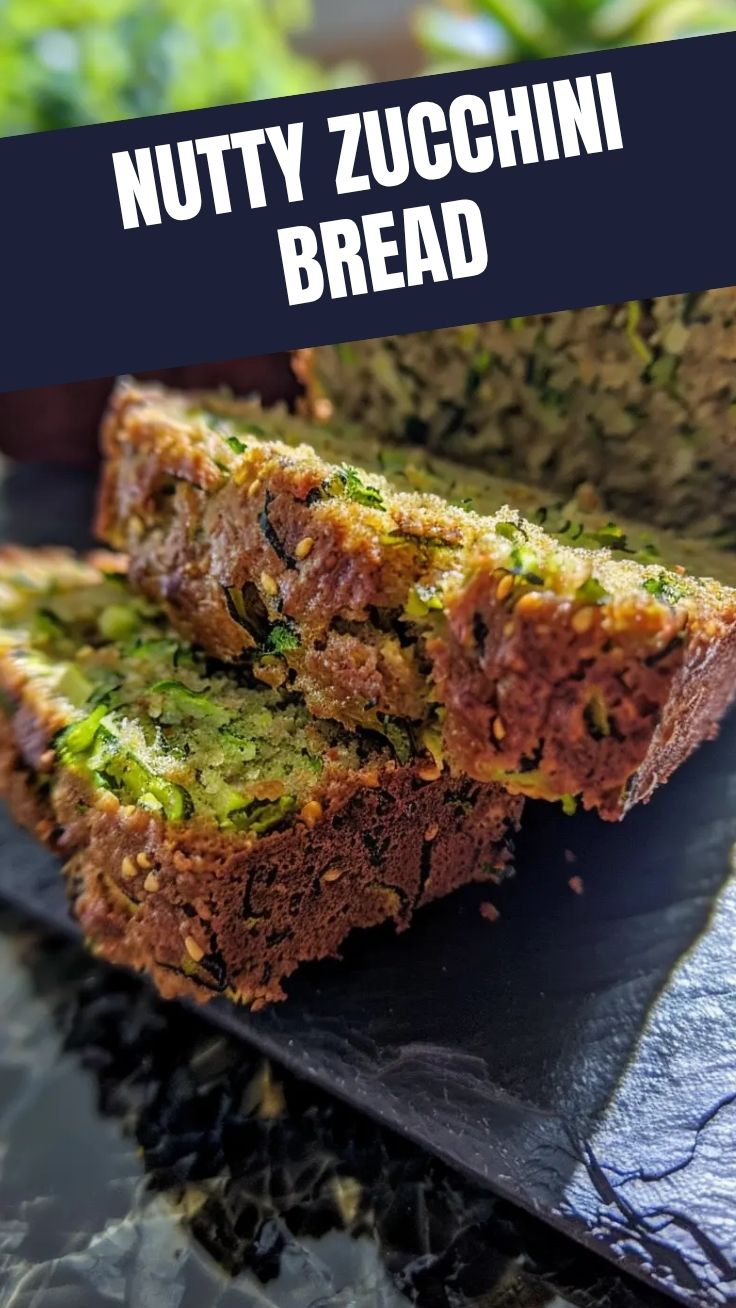 A freshly baked loaf of zucchini bread, golden brown and moist.