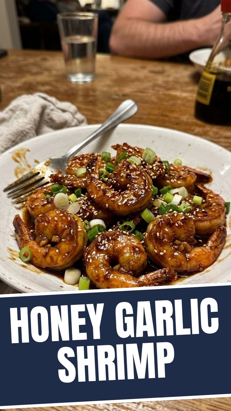 Close-up of perfectly cooked honey garlic shrimp in a pan
