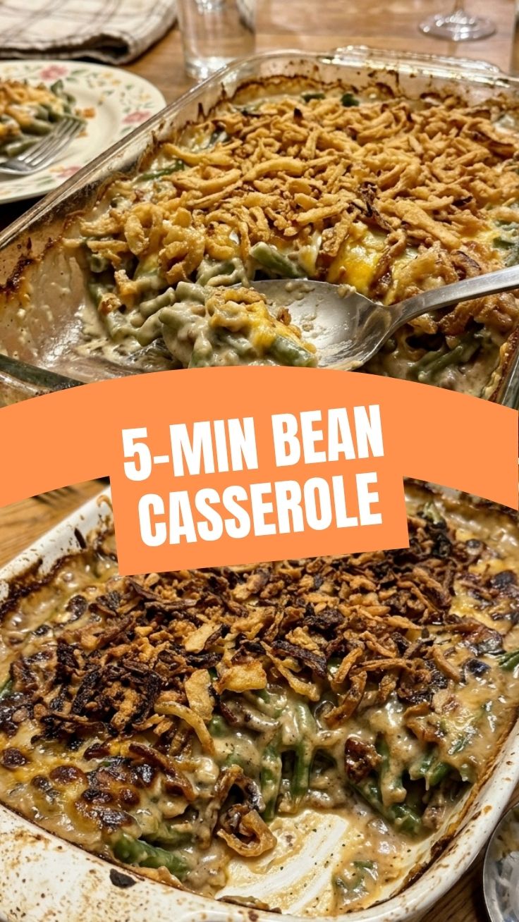 A classic green bean casserole, golden brown and bubbly, in a white baking dish.