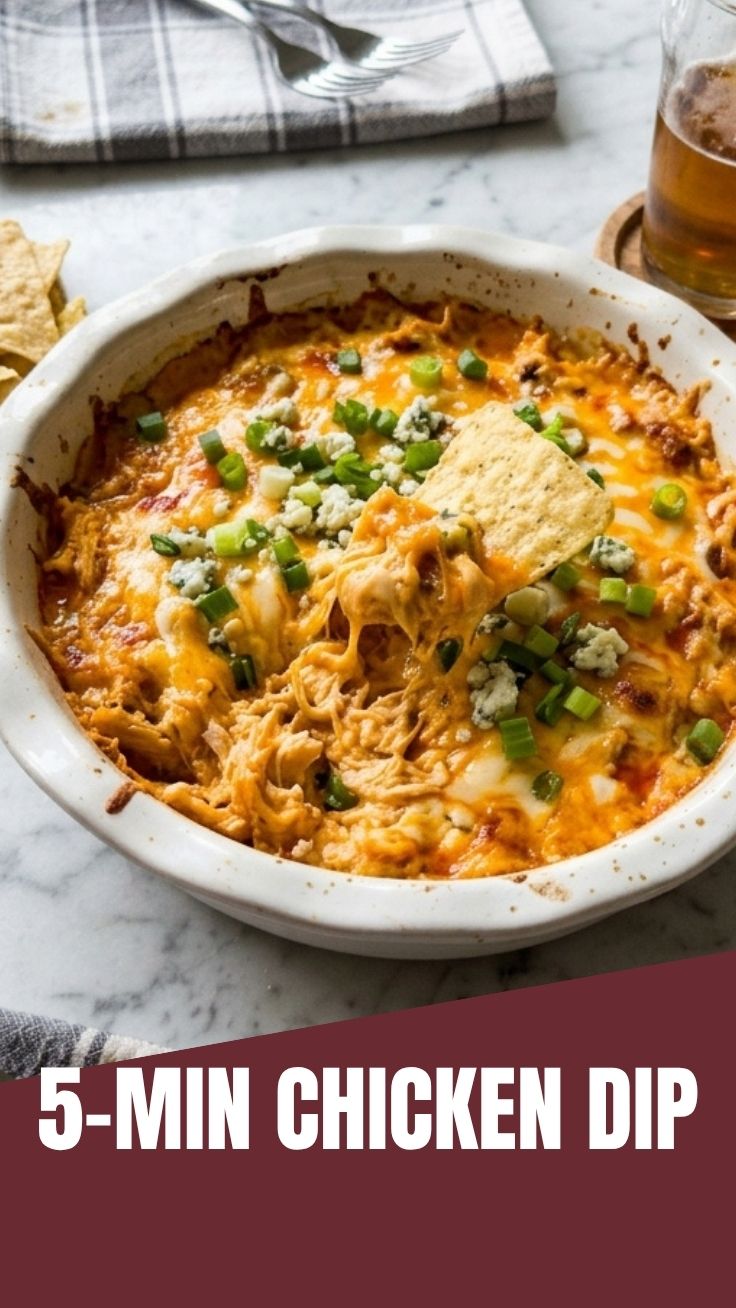 A warm, bubbling Buffalo Chicken Dip in a ceramic dish.
